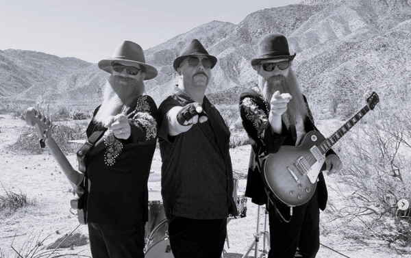 Black and white colored picture of all three ZZ Top tribute artists pointing to camera for pictures | Altus Entertainment